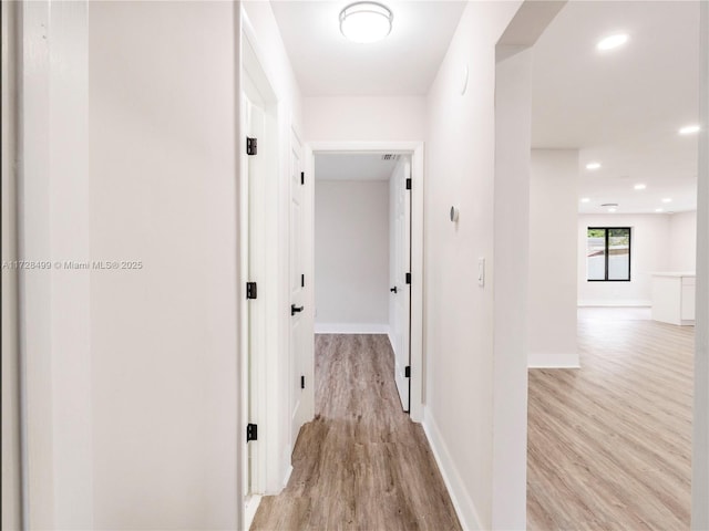 hallway featuring light wood-type flooring