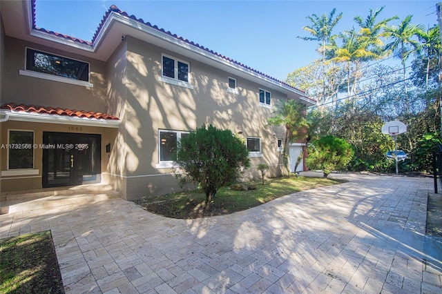 view of side of home with a patio