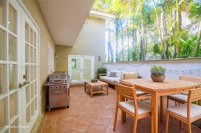 exterior space featuring french doors, a grill, and an outdoor hangout area