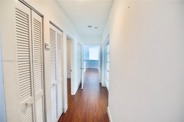 hallway featuring dark hardwood / wood-style floors