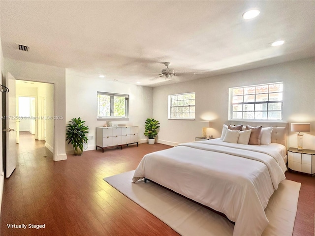 bedroom featuring hardwood / wood-style flooring and ceiling fan