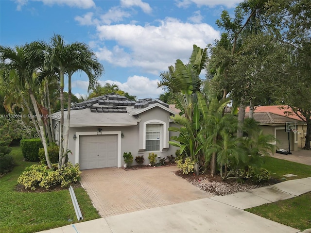 view of front of property with a garage