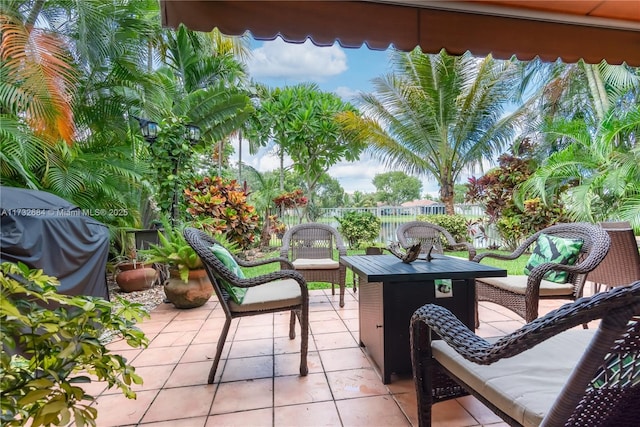 view of patio with area for grilling and an outdoor hangout area