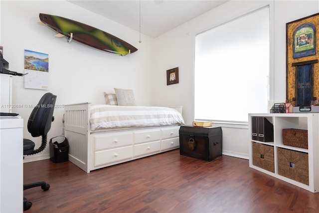 bedroom featuring dark hardwood / wood-style flooring