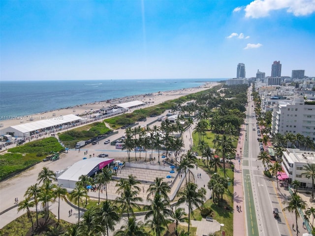 bird's eye view featuring a water view and a beach view