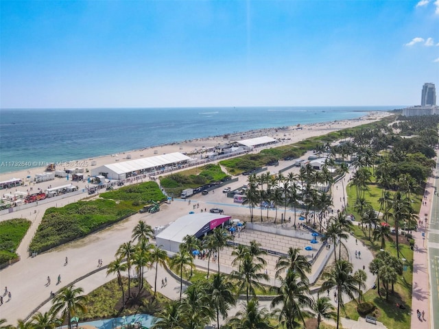 birds eye view of property featuring a beach view and a water view