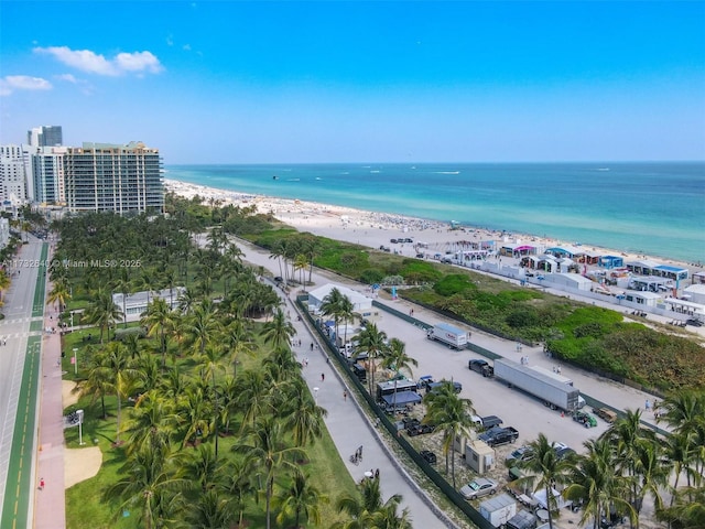 drone / aerial view with a water view and a view of the beach