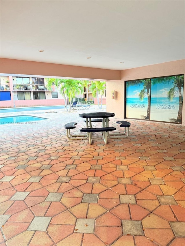 view of patio / terrace featuring a pool