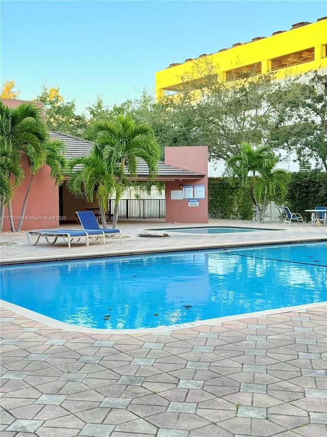 view of pool featuring a patio