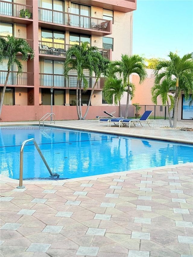 view of swimming pool with a patio