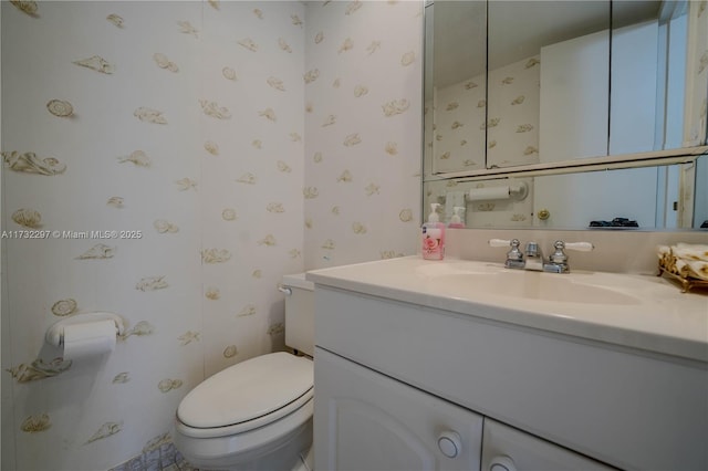 bathroom with vanity and toilet