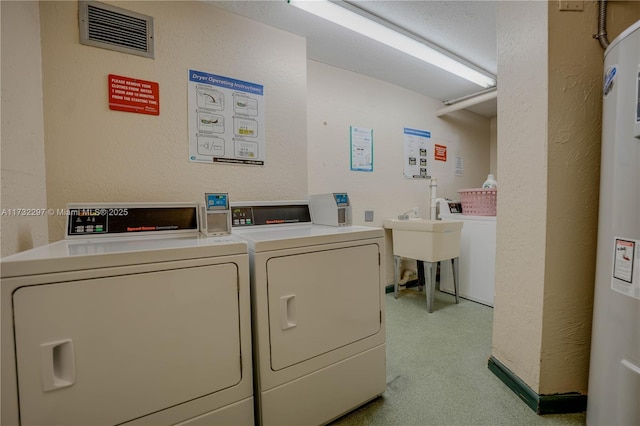 laundry room with washing machine and clothes dryer