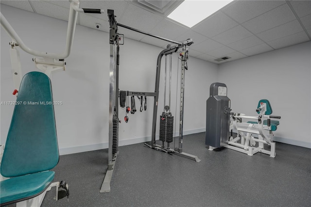 exercise room featuring a drop ceiling