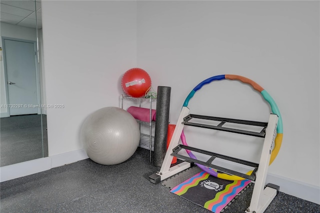 workout area featuring a drop ceiling