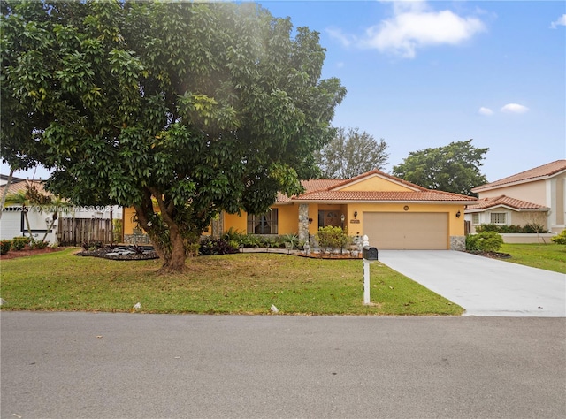 view of front of home with a garage and a front yard