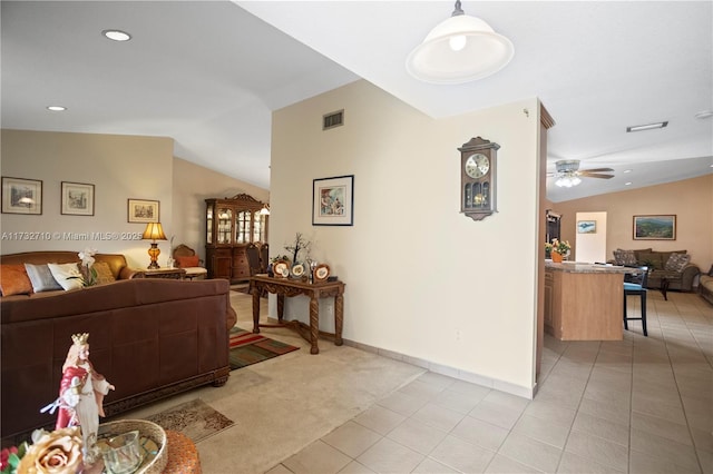 hallway featuring vaulted ceiling and light carpet