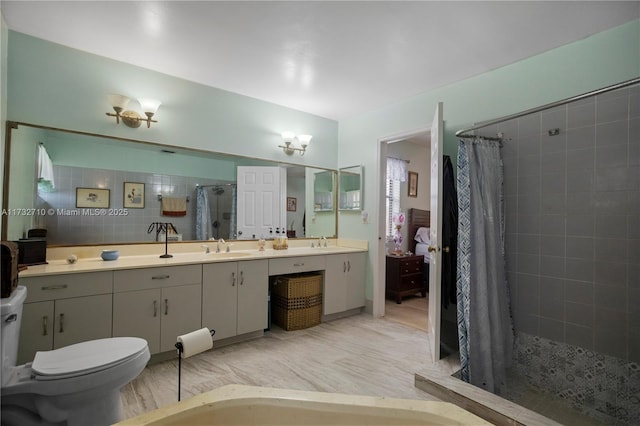 bathroom with vanity, walk in shower, and toilet