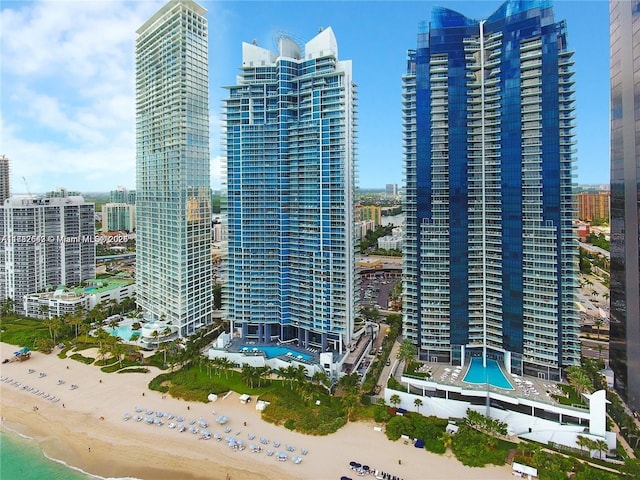 view of property featuring a water view and a view of the beach