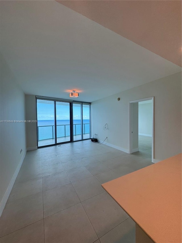 spare room featuring expansive windows