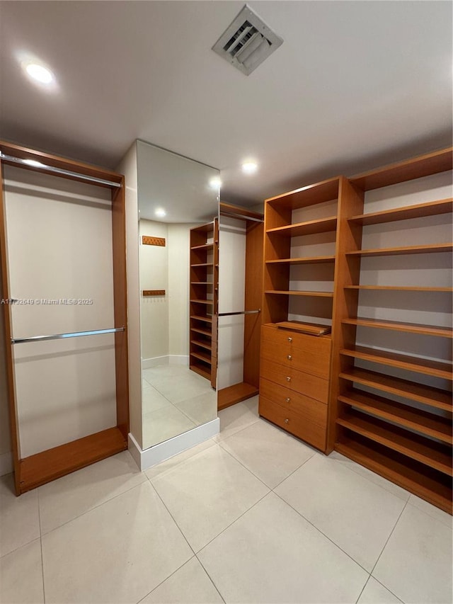 walk in closet featuring light tile patterned floors