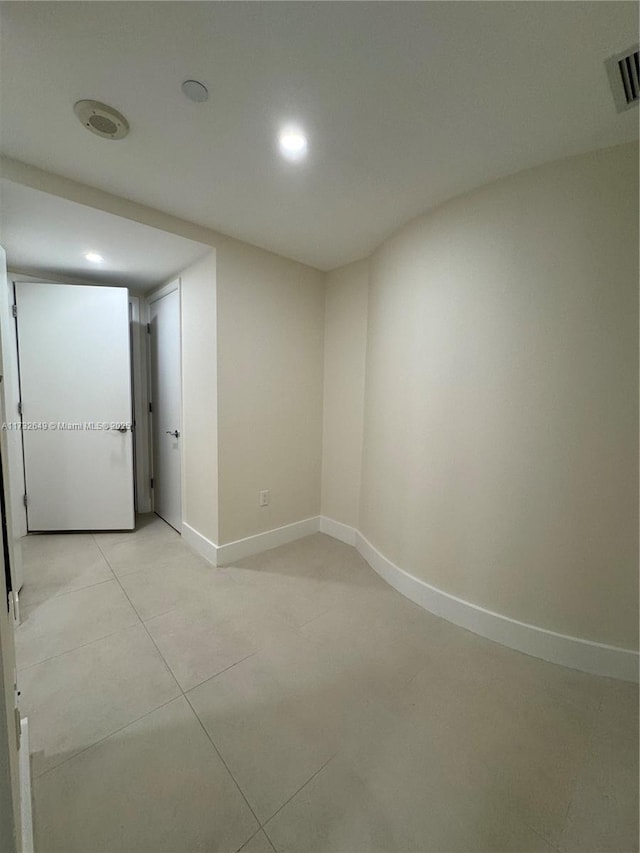 spare room with light tile patterned floors