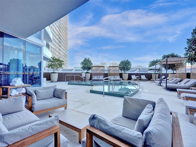 view of swimming pool featuring an outdoor living space, a pergola, and a patio area