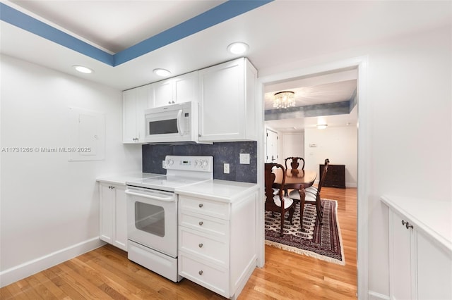 kitchen featuring white cabinetry, white appliances, decorative backsplash, and light hardwood / wood-style flooring