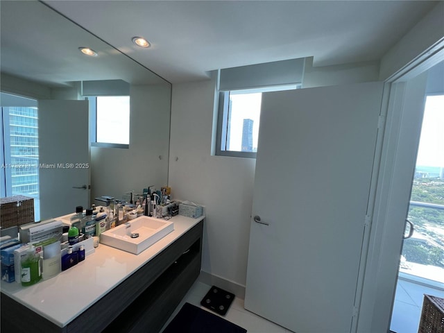 bathroom with vanity and tile patterned flooring