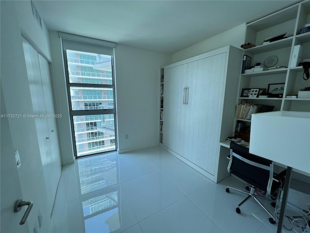 home office featuring light tile patterned flooring