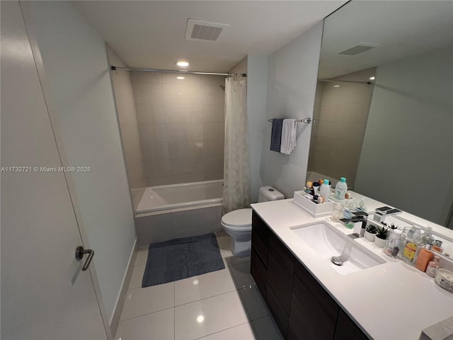 full bathroom featuring shower / bath combination with curtain, tile patterned floors, toilet, and vanity