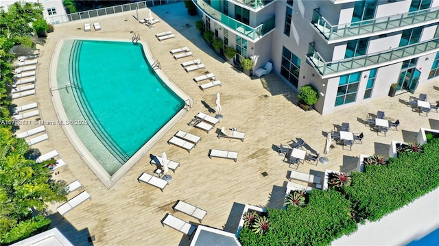 view of swimming pool with a patio