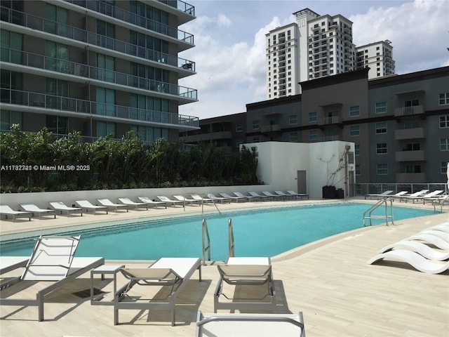 view of swimming pool featuring a patio