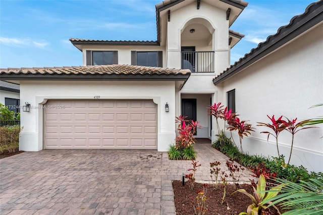 mediterranean / spanish house featuring a garage