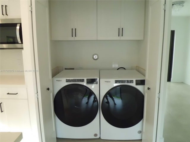 laundry room featuring washer and clothes dryer