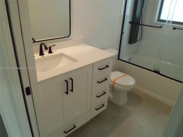 full bathroom with vanity, toilet, and bath / shower combo with glass door