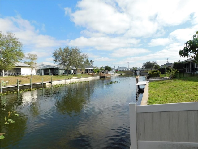 property view of water with a dock