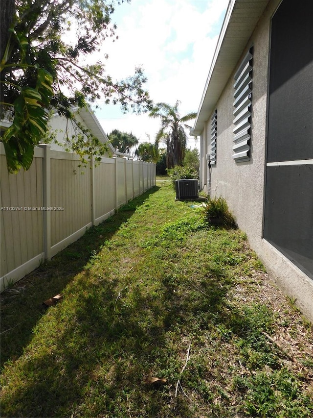 view of yard with central AC