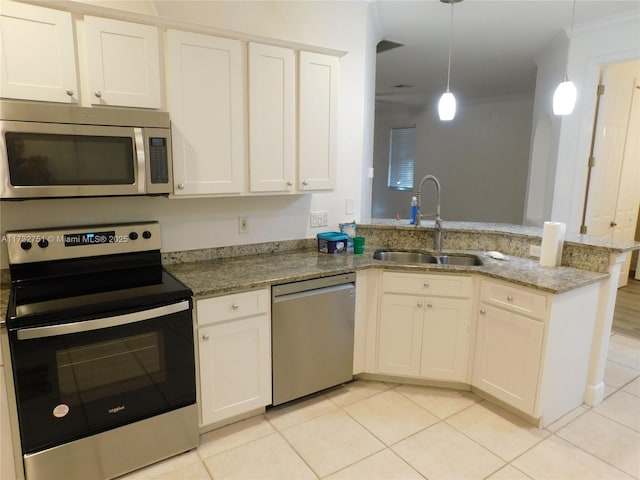 kitchen with stainless steel appliances, light tile patterned flooring, sink, and pendant lighting