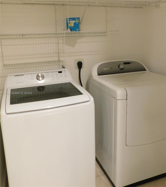 washroom with independent washer and dryer