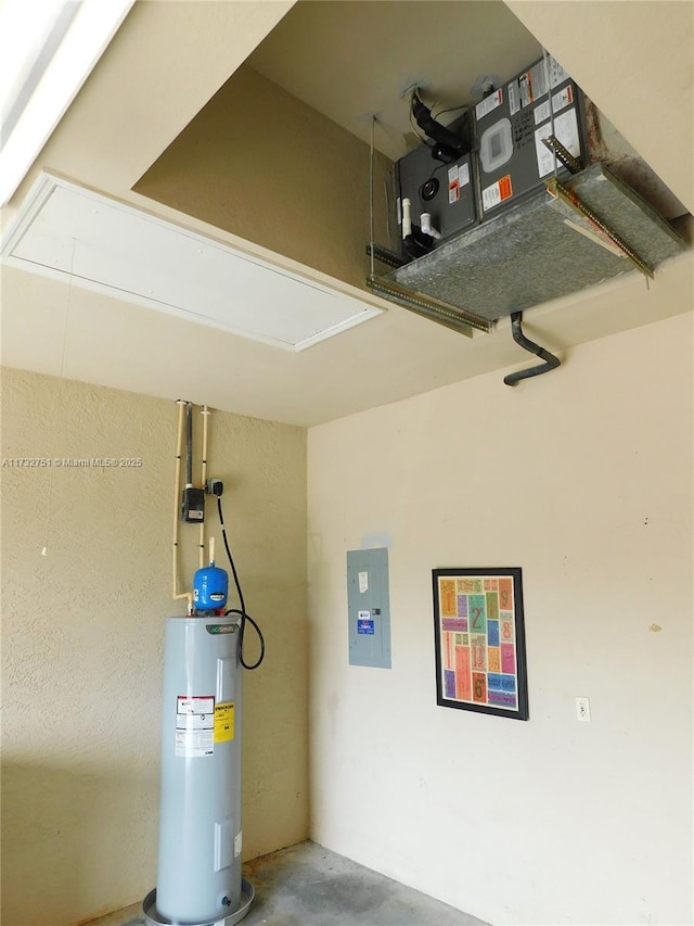 garage with electric panel and water heater