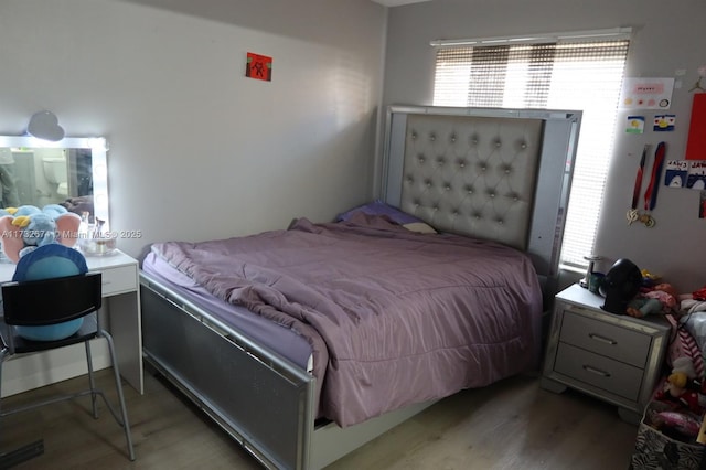 bedroom featuring hardwood / wood-style floors