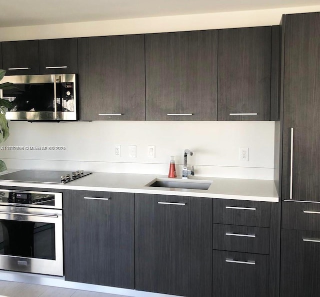 kitchen featuring appliances with stainless steel finishes and sink