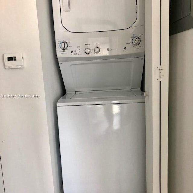 laundry room featuring stacked washing maching and dryer