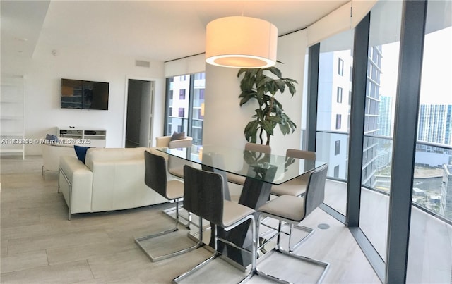 dining room with a wall of windows