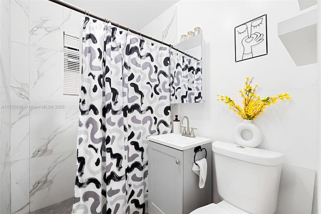 bathroom with vanity, toilet, and a shower with shower curtain