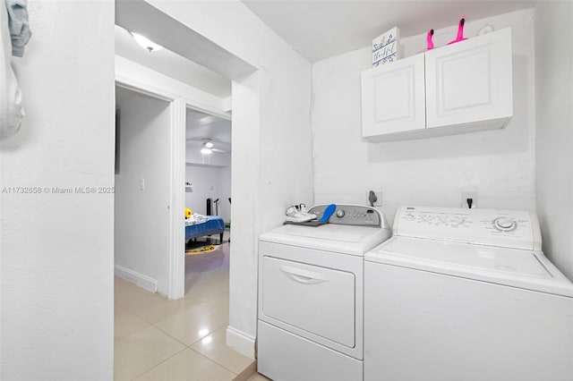 laundry room featuring ceiling fan, washing machine and clothes dryer, and light tile patterned floors