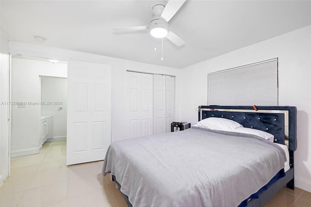 bedroom featuring a closet, ceiling fan, and light tile patterned flooring