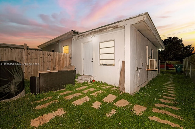 view of property exterior at dusk