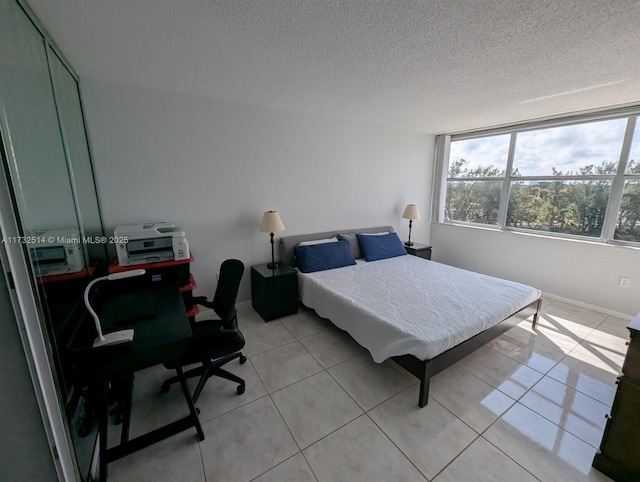 tiled bedroom with a textured ceiling