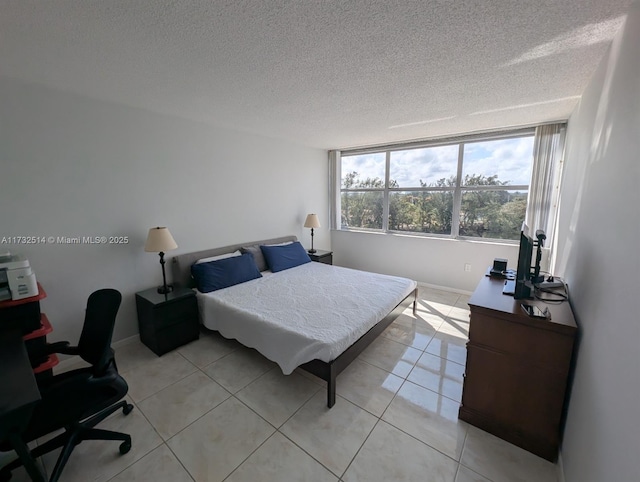 tiled bedroom with a textured ceiling